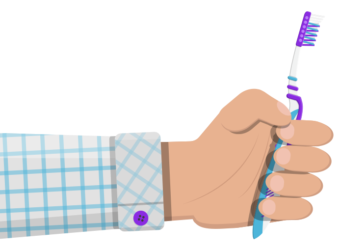 hand holding manualtoothbrush